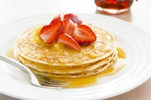 Traditional pancakes with maple syrup butter & strawberries, photo by Chris Chen