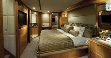 The master stateroom spreads across the full beam of the boat amidships