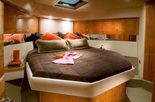The Master Stateroom, forward, is clean and uncluttered with subtle timber styling.