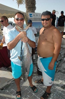 After a day fishing the Arabian Gulf, these anglers show off their catch