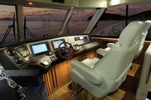 The helm features twin chairs and opening hatches in the ceiling to let breezes through
