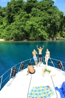 Family and friends gather at the bow to enjoy the sun