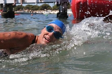 A solo swimmer comes into Rottnest after 10 hours of swimming