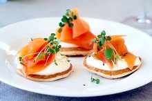 Mini pikelets with smoked salmon and creme fraiche - photo by Steve Brown