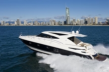 The 5800 Sport Yacht cruises past the city
