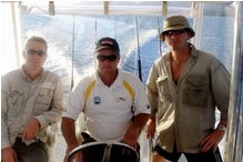 Casey Dent at the helm with Mark (left) and-Rick (right) searching for game