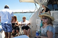 Lisanne sitting in front with friends on board Intuition