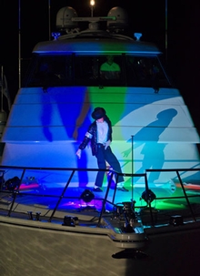 Michael Jackson impersonator performs on the bow of the 70 at the VIP launch party