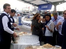 Riviera enthusiasts enjoy drinks and hors d'oeuvres at the Genoa Boat Show