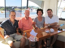 Adrian and Joanne de Bruin (centre) celebrate the delivery of their new Riviera with Paul Harrop and Ross Almond from R Marine SA