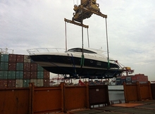 The new Riviera 5800 Sport Yacht is loaded onto the ship bound for France