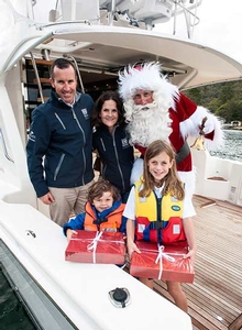 R Marine Riley dealer principal Mark Riley and his family greet Santa