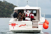 Santa delivers gifts to the crew on board Riviera 445 SUV