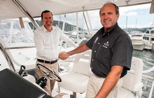 Long serving Riviera dealer principal Lee Dillon (right) hands over the helm to Mark Riley (left) who opened R Marine Riley's Pittwater office today