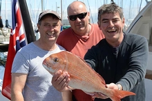 Riviera owner Barry Cuneo with his crew Andrew Gorman and George Tzilantonis holding the first snapper caught on Whirlwind